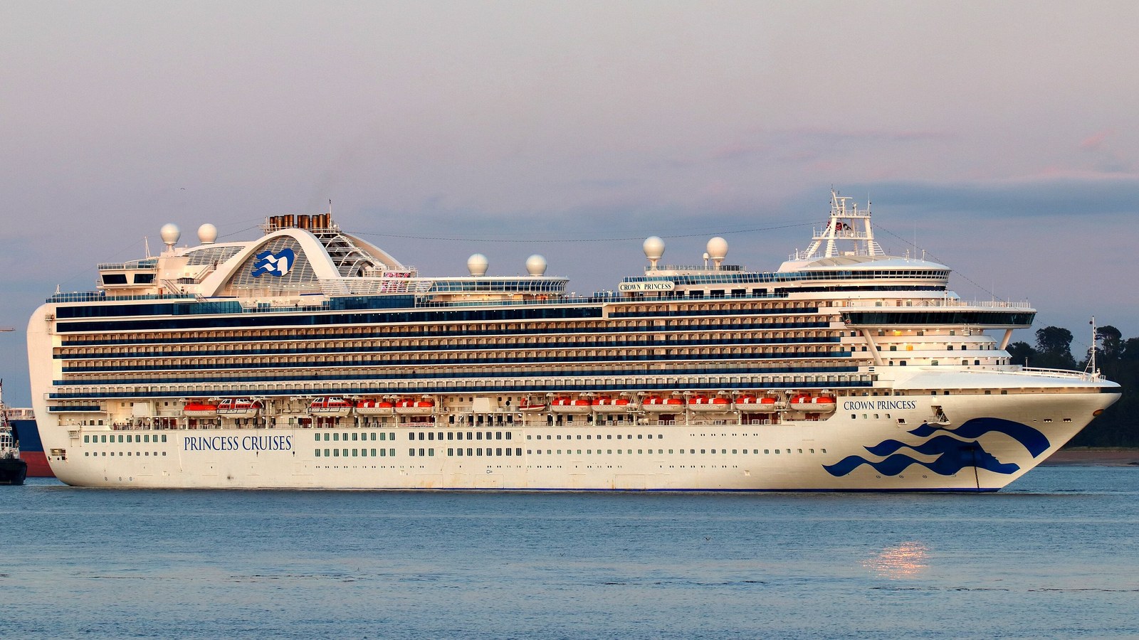 Crown Princess alongside, the Princess seawitch logo on the funnel