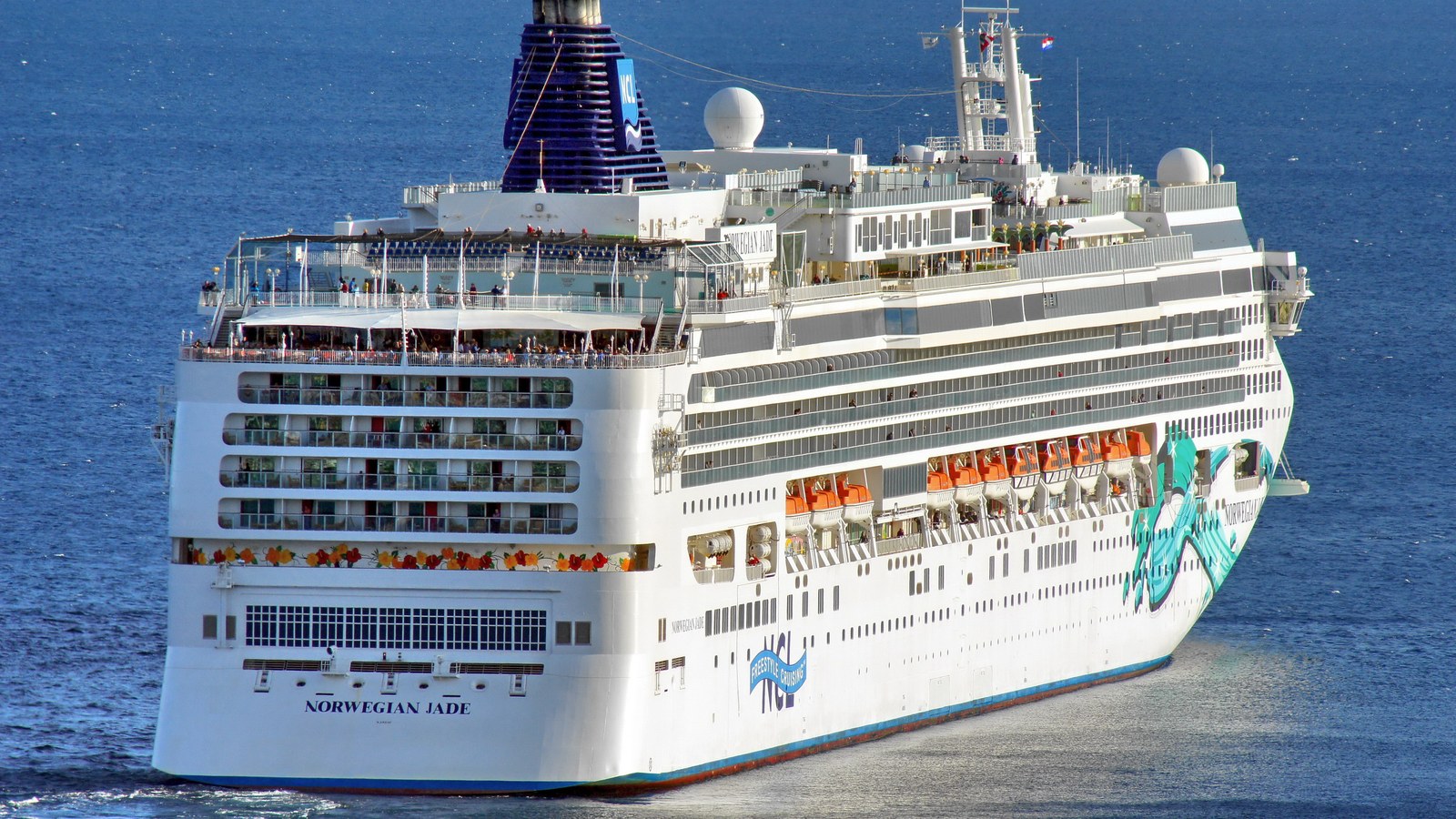 Norwegian Jade under way, the ship's name visible on the bow