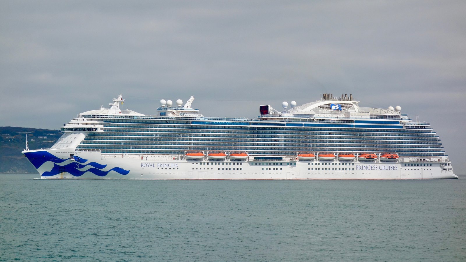 Royal Princess under way with the Princess Cruises name along the hull