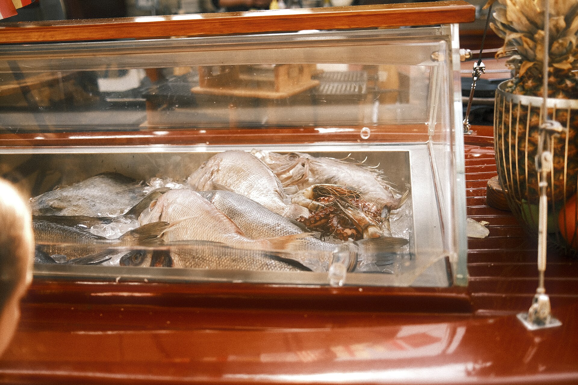 Fresh fish on ice at a market seafood counter