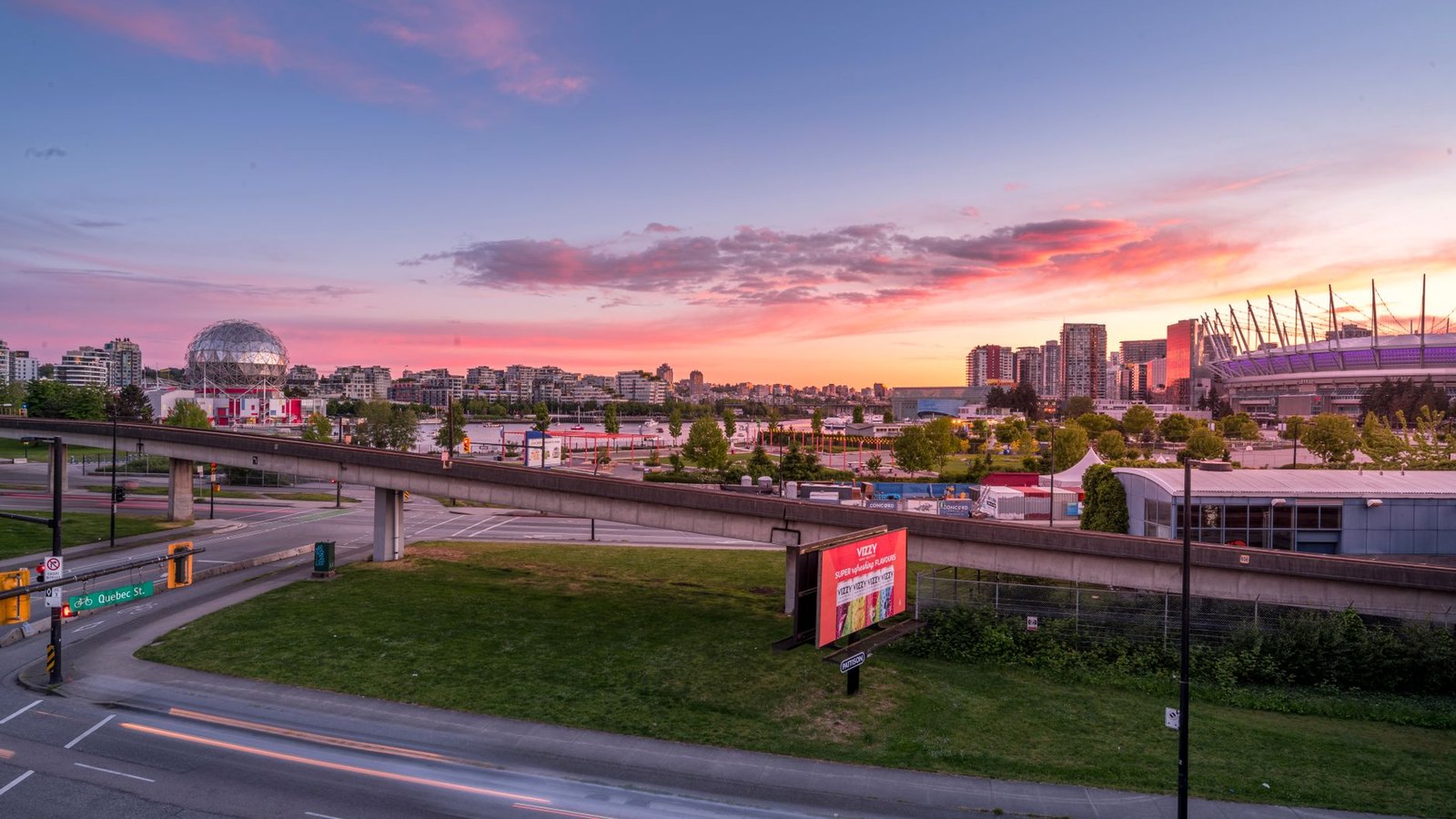 Downtown Vancouver skyline at sunset — Science World and BC Place across False Creek