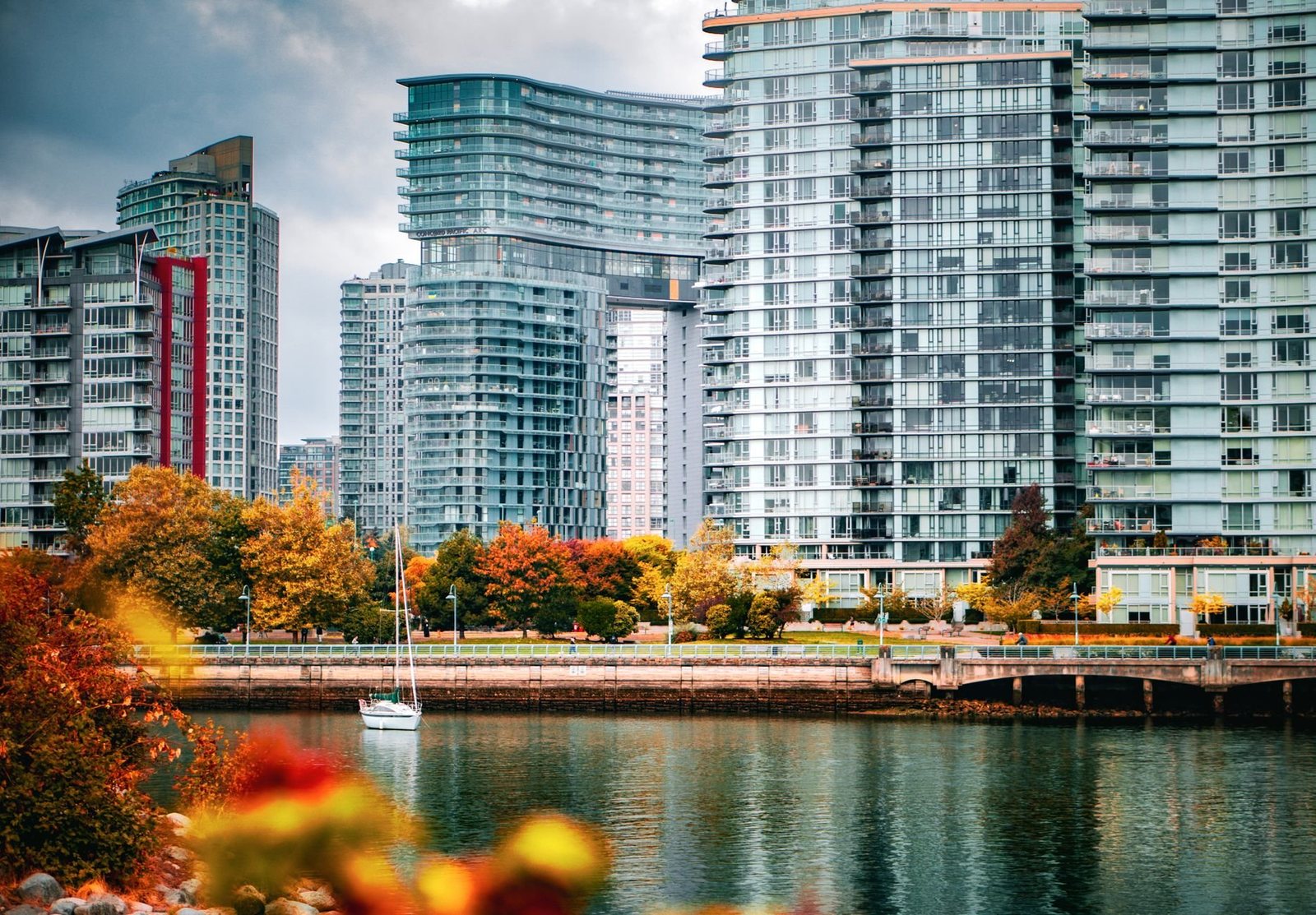 Autumn colour along the False Creek seawall below Vancouver towers