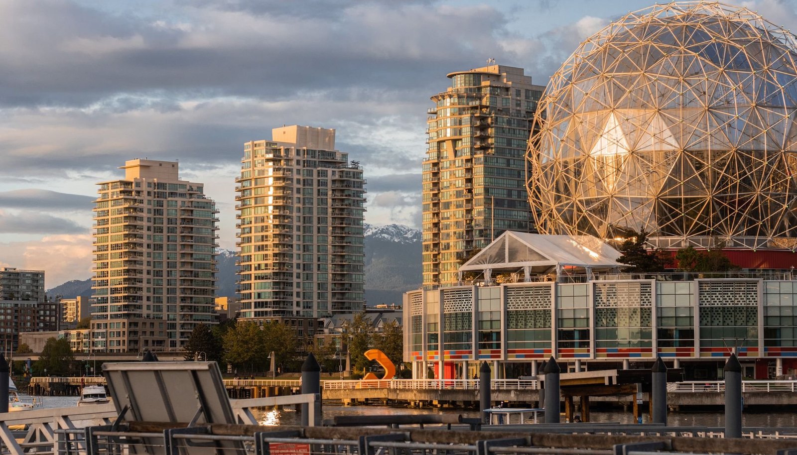 Science World's geodesic dome and False Creek towers in golden evening light