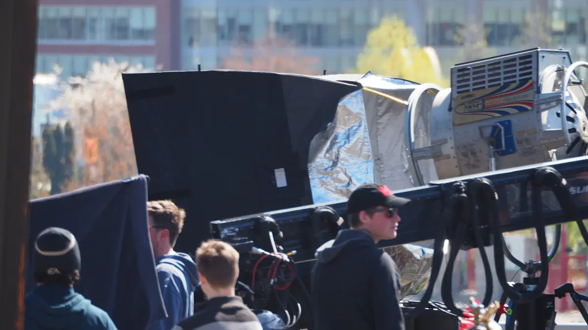 The Deadpool unit on the closed viaduct, April 2015 — lighting rig, crew, downtown behind.
