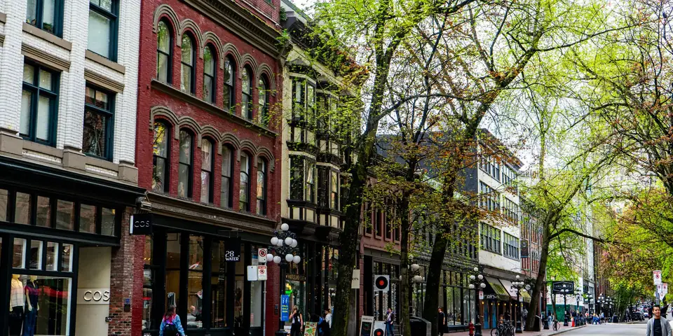 Brick buildings and trees along a Gastown street