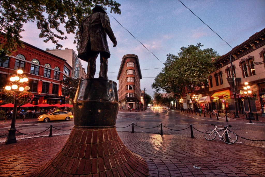The bronze statue of Gassy Jack Deighton standing on a whisky barrel in Maple Tree Square, Gastown