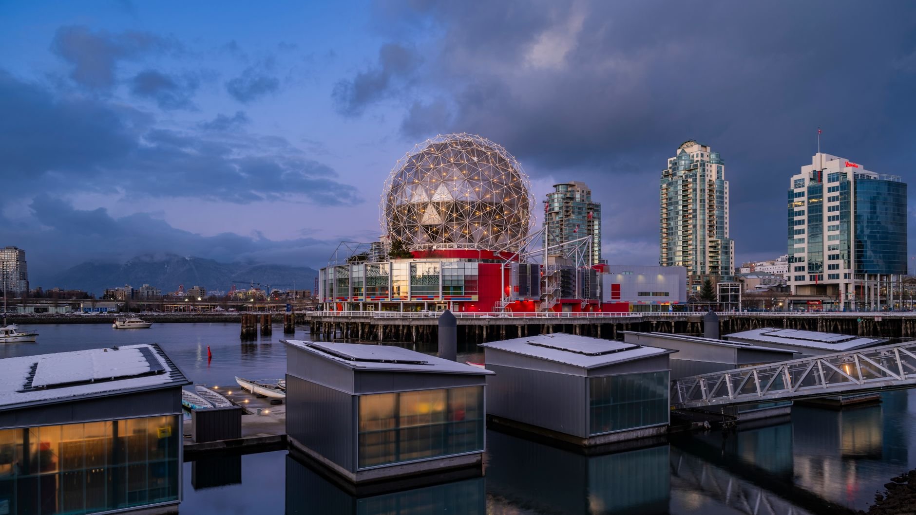 Science World and the False Creek waterfront at dusk, east of the Rogers Arena district