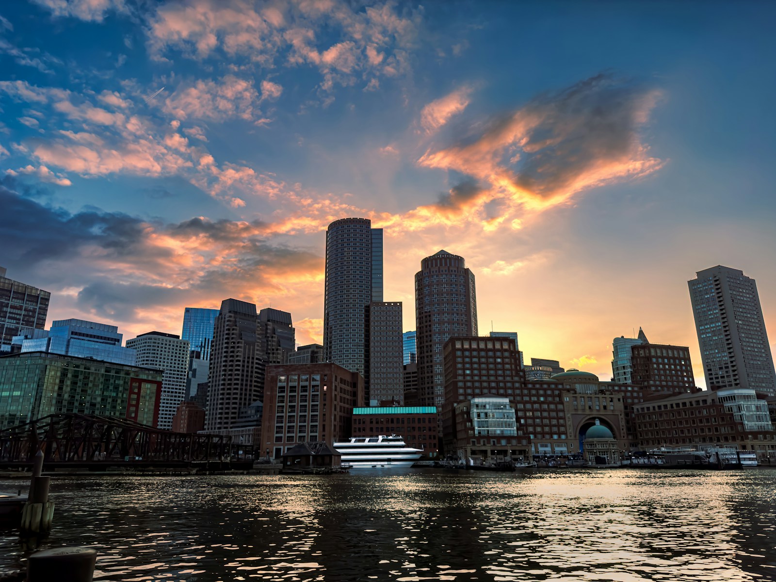 Boston harbor and downtown skyline at evening