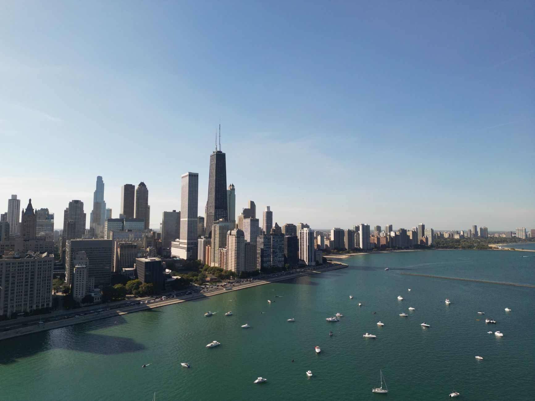 Chicago skyline along Lake Michigan under clear sky