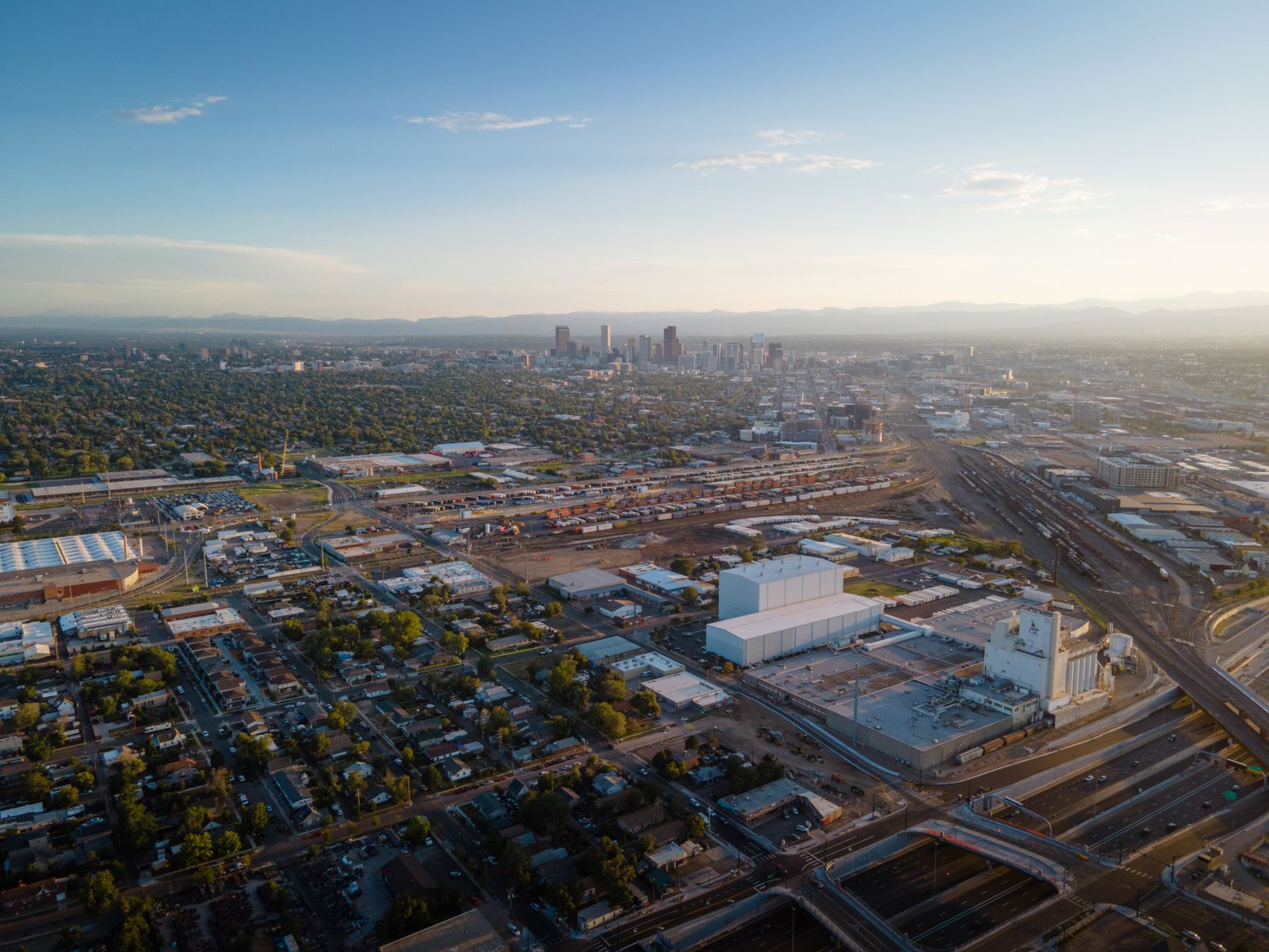 Denver skyline with the Rocky Mountains rising behind the city