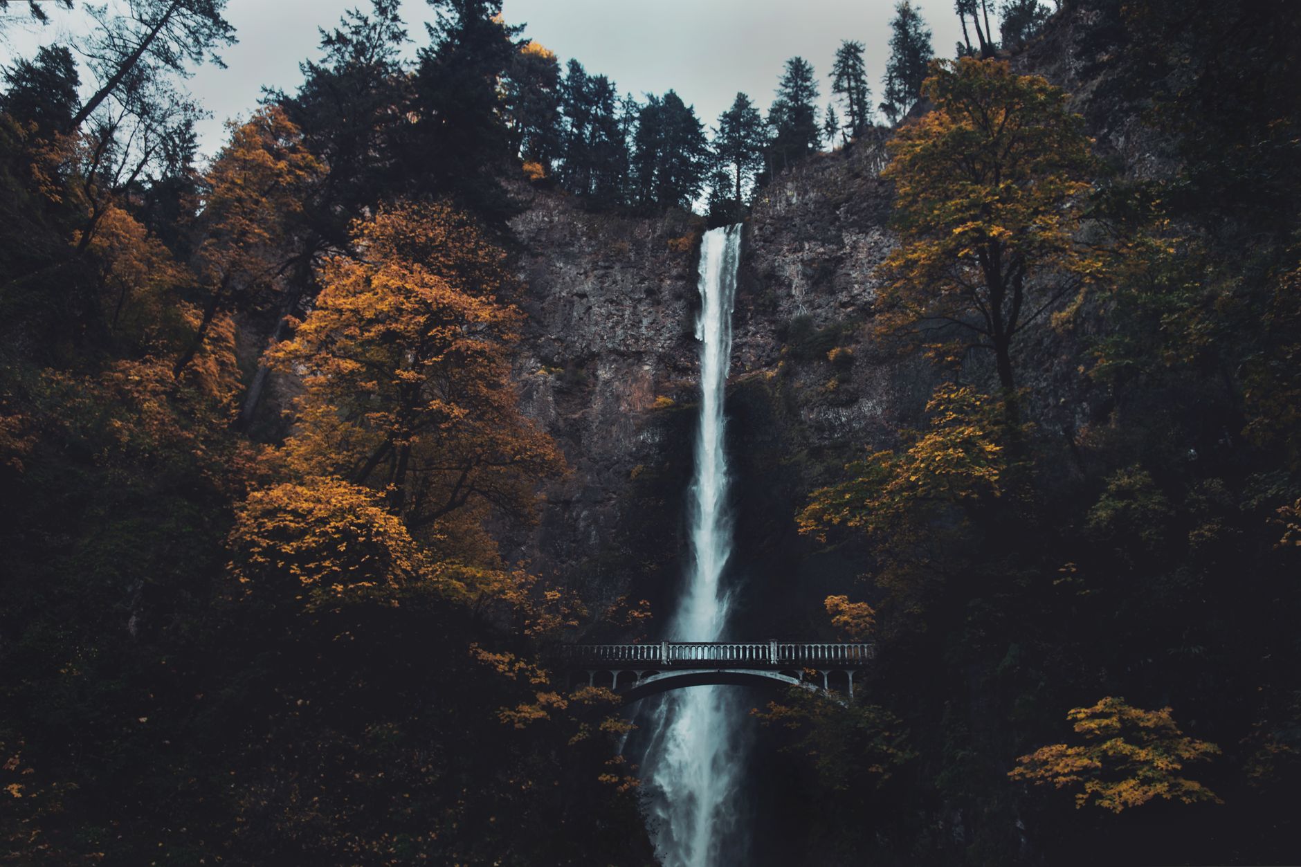 Multnomah Falls and its stone footbridge in the Columbia River Gorge